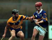 22 October 2000; Brian Forde of Clare in action against Adrian Cleere of Tipperary during the Waterford Crystal South East Hurling League match between Clare and Tipperary at Cusack Park in Ennis, Clare. Photo by Brendan Moran/Sportsfile