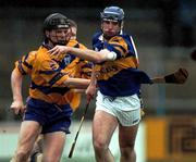 22 October 2000; Eoin Kelly of Tipperary in action against Frank Lohan of Clare during the Waterford Crystal South East Hurling League match between Clare and Tipperary at Cusack Park in Ennis, Clare. Photo by Brendan Moran/Sportsfile