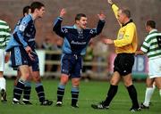 22 October 2000; Ciaran Kavanagh of UCD, centre, and Eamon McLaughlin, left, remonstrates with referee Hugh Byrne during the Eircom League Premier Division match between UCD and Shamrock Rovers at Belfield Park in Dublin. Photo by Ray Lohan/Sportsfile