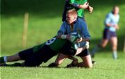 21 October 2000; Bobby Quigley of UCD is tackled by Peter Spence of Ballynahinch during the All-Ireland League Division 2 match between UCD and Ballynahinch at Belfield Park in Dublin. Photo by Ray McManus/Sportsfile