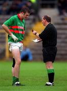 22 October 2000; Patrick Brady of Gowna has his name taken by referee Brendan Gorman during the Ulster GAA Football Senior Club Championship Semi-Final match between Bellaghy and Gowna at St Tiernach's Park in Clones, Monaghan. Photo by Ray McManus/Sportsfile