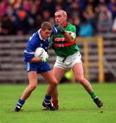 22 October 2000; Gavin Diamond of Bellaghy, left, in action against Bernard Morris of Gowna during the Ulster GAA Football Senior Club Championship Semi-Final match between Bellaghy and Gowna at St Tiernach's Park in Clones, Monaghan. Photo by Ray McManus/Sportsfile