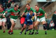 22 October 2000; Cathal Scullion of Bellaghy in action against Gavin Hartin, left and Laurence Brady of Gowna during the Ulster GAA Football Senior Club Championship Semi-Final match between Bellaghy and Gowna at St Tiernach's Park in Clones, Monaghan. Photo by Ray McManus/Sportsfile