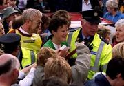 15 October 2000; Sonia O'Sullivan is escorted through the crowd by members of An Garda S’ochána following the Loughrea 5 Mile Road Race in Loughrea, Galway. Athletics. Photo by Damien Eagers/Sportsfile