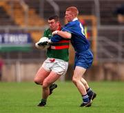22 October 2000; Fergal Hartin of Gowna in action against Fergal Doherty of Bellaghy during the Ulster GAA Football Senior Club Championship Semi-Final match between Bellaghy and Gowna at St Tiernach's Park in Clones, Monaghan. Photo by Ray McManus/Sportsfile