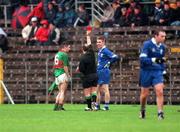 22 October 2000; Cathaldus Hartin of Gowna, left, is shown the red card by referee Brendan Gorman during the Ulster GAA Football Senior Club Championship Semi-Final match between Bellaghy and Gowna at St Tiernach's Park in Clones, Monaghan. Photo by Ray McManus/Sportsfile