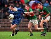 22 October 2000; David O'Neill of Bellaghy in action against Gerald Pearson of Gowna during the Ulster GAA Football Senior Club Championship Semi-Final match between Bellaghy and Gowna at St Tiernach's Park in Clones, Monaghan. Photo by Ray McManus/Sportsfile