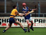 22 October 2000; Adrian Cleere of Tipperary in action against Gordon Malone of Clare during the Waterford Crystal South East Hurling League match between Clare and Tipperary at Cusack Park in Ennis, Clare. Photo by Brendan Moran/Sportsfile