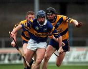 22 October 2000; Eoin Kelly of Tipperary in action against Frank Lohan and Kenneth Kennedy of Clare during the Waterford Crystal South East Hurling League match between Clare and Tipperary at Cusack Park in Ennis, Clare. Photo by Brendan Moran/Sportsfile