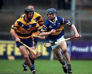 22 October 2000; Paul Kelly of Tipperary in action against Brian Forde of Clare during the Waterford Crystal South East Hurling League match between Clare and Tipperary at Cusack Park in Ennis, Clare. Photo by Brendan Moran/Sportsfile