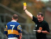 22 October 2000;  Referee John Sexton shows a yellow card to Dermot Gleeson of Tipperary during the Waterford Crystal South East Hurling League match between Clare and Tipperary at Cusack Park in Ennis, Clare. Photo by Brendan Moran/Sportsfile