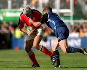 21 October 2000; Alan Quinlan of Munster is tackled by Dan Lyle of Bath during the Heineken Cup Pool 4 match between Munster and Bath at Thomond Park in Limerick. Photo by Brendan Moran/Sportsfile
