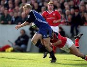 21 October 2000; Iain Balshaw of Bath is tackled by Dominic Crotty of Munster during the Heineken Cup Pool 4 match between Munster and Bath at Thomond Park in Limerick. Photo by Brendan Moran/Sportsfile