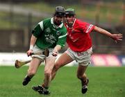 22 October 2000; Paidi Reale of Limerick breaks away from Eoin Fitzgerald of Cork during the Waterford Crystal South East Hurling League match between Limerick and Cork at Gaelic Grounds in Limerick. Photo by Damien Eagers/Sportsfile