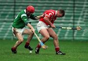 22 October 2000; Don Anderson of Limerick in action against Pat Sexton of Cork during the Waterford Crystal South East Hurling League match between Limerick and Cork at Gaelic Grounds in Limerick. Photo by Damien Eagers/Sportsfile