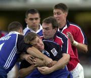 28 October 2000; Matt Perry of Bath is tackled by John Kelly of Munster during the Heineken European Cup Pool 4 Round 4 match between Bath and Munster at the Recreation Ground in Bath, England. Photo by Matt Browne/Sportsfile