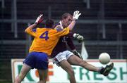 29 October 2000; Kenny Naughton of Galway in action against Ger Mockler of Roscommon during the Church & General National Football League Division 1A match between Roscommon and Galway at Dr Hyde Park in Roscommon. Photo by Damien Eagers/Sportsfile
