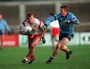 29 October 2000; Owen Mulligan of Tyrone in action against Ian Clarke of Dublin during the Church & General National Football League Division 1A match between Dublin and Tyrone at Parnell Park in Dubln. Photo by Ray McManus/Sportsfile