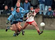 29 October 2000; Stephen O'Neill of Tyrone in action against Paddy Christie of Dublin during the Church & General National Football League Division 1A match between Dublin and Tyrone at Parnell Park in Dubln. Photo by Ray McManus/Sportsfile