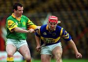 30 October 2000; Anthony Foley of Patrickswell in action against Michael O'Meara of Toomevara during the AIB Munster Senior Club Hurling Championship Quarter-Final match between Toomevara and Patrickswell at Semple Stadium in Thurles, Tipperary. Photo by Ray McManus/Sportsfile