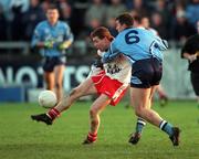 29 October 2000; Damien Gormley of Tyrone in action against Jonathan Magee of Dublin during the Church & General National Football League Division 1A match between Dublin and Tyrone at Parnell Park in Dubln. Photo by Ray McManus/Sportsfile