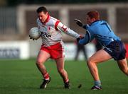 29 October 2000; Paul Feeney of Tyrone in action against Peadar Andrews of Dublin during the Church & General National Football League Division 1A match between Dublin and Tyrone at Parnell Park in Dubln. Photo by Ray McManus/Sportsfile