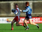 29 October 2000; Ciaran Gourley of Tyrone in action against Peadar Andrews of Dublin during the Church & General National Football League Division 1A match between Dublin and Tyrone at Parnell Park in Dubln. Photo by Ray McManus/Sportsfile