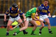 30 October 2000; Des Foley of Patrickswell in action against John O'Brien of Toomevara during the AIB Munster Senior Club Hurling Championship Quarter-Final match between Toomevara and Patrickswell at Semple Stadium in Thurles, Tipperary. Photo by Ray McManus/Sportsfile