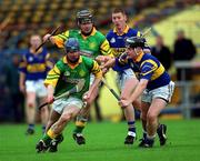 30 October 2000; Paddy O'Brien of Toomevara in action against Des Foley of Patrickswell during the AIB Munster Senior Club Hurling Championship Quarter-Final match between Toomevara and Patrickswell at Semple Stadium in Thurles, Tipperary. Photo by Ray McManus/Sportsfile
