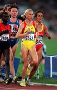 22 September 2000; Gabriela Szabo of Romania, yellow, leads the field on her way to winning the third heat of the Women's 5000m at Stadium Australia in the Sydney Olympic Park in Homebush Bay, Sydney, Australia. Photo by Brendan Moran/Sportsfile
