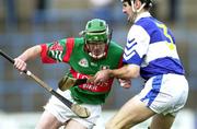 4 November 2000; Rory Hanniffy of Birr in action against Paul Cuddy of Castletown during the AIB Leinster Club Hurling Championship Quarter-Final match between Castletown and Birr at O'Moore Park in Portlaoise, Laois. Photo by Ray McManus/Sportsfile