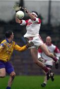 5 November 2000; Terry Drake of Abbeylara in action against Karl Donnelly of Na Fianna during the AIB Leinster Senior Club Football Championship Quarter-Final match between Abbeylara and Na Fianna at Pearse Park in Longford. Photo by Ray McManus/Sportsfile