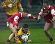 5 November 2000; Senan Connell of Na Fianna in action against Edmund Farrell, left, and Gearoid Fay of Abbeylara during the AIB Leinster Senior Club Football Championship Quarter-Final match between Abbeylara and Na Fianna at Pearse Park in Longford. Photo by Ray McManus/Sportsfile