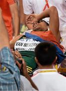 26 August 2015; Wayde van Niekerk of South Africa leaves the track on a stretcher after winning the final of the Men's 400m event. IAAF World Athletics Championships Beijing 2015 - Day 5, National Stadium, Beijing, China. Picture credit: Stephen McCarthy / SPORTSFILE