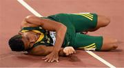 26 August 2015; Wayde van Niekerk of South Africa collapses after winning the final of the Men's 400m event. IAAF World Athletics Championships Beijing 2015 - Day 5, National Stadium, Beijing, China. Picture credit: Stephen McCarthy / SPORTSFILE