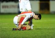 18 February 2009; Jason Gavin, St Patrick's Athletic, holds his ankle after picking up an injury in the second half. Pre-Season Friendly, St Patrick's Athletic v Chelsea XI. Richmond Park, Dublin. Picture credit: Diarmuid Greene / SPORTSFILE