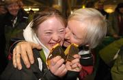 16 February 2009; Clara Keoghan, TEAM Ireland, sponsored by eircom, from Ballsbridge, Dublin, who won two Bronze medals at the Special Olympics World Winter Games, gets a congratulatory kiss from her mother Phil on her arrival home at Dublin Airport. Photo by Sportsfile