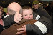 16 February 2009; Ben Purcell, TEAM Ireland, sponsored by eircom, from Dalkey, Co. Dublin, hugs his uncle Phillip Purcell on his arrival home at Dublin Airport. Photo by Sportsfile