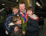 16 February 2009; Ben Purcel, TEAM Ireland, sponsored by eircom, from Dalkey, Co. Dublin, who won a Gold medal at the Special Olympics World Winter Games, with his cousins, Robert Maher, left, Oscar Maher and Andrew Maher, right, on his arrival home at Dublin Airport. Photo by Sportsfile