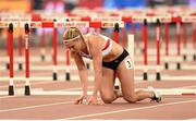 27 August 2015; Beate Schrott of Austria after falling at the final hurdle during her semi-final of the Women's 100m Hurdles event. IAAF World Athletics Championships Beijing 2015 - Day 6, National Stadium, Beijing, China. Picture credit: Stephen McCarthy / SPORTSFILE