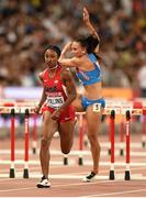 28 August 2015; Brianna Rollins of USA on her way to winning her semi-final of the Women's 100m Hurdles event as Andrea Ivancevic of Croatia takes a fall. IAAF World Athletics Championships Beijing 2015 - Day 7, National Stadium, Beijing, China. Picture credit: Stephen McCarthy / SPORTSFILE