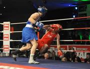 20 February 2009; Philip Sutcliffe, Crumlin, left, knocks down John Joe Joyce, St Michael's Athy, during their 64KG bout. National Senior Boxing Championships Finals, National Stadium, Dublin. Picture credit: Ray Lohan / SPORTSFILE