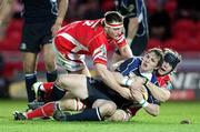 21 February 2009; Scarlets' Ken Owens and Simon Easterby combine to stop Paul O'Donohoe, Leinster. Magners League, Scarlets v Leinster. Parc Y Scarlets, Wales. Picture credit: Steve Pope / SPORTSFILE