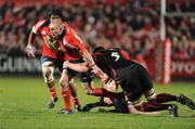 21 February 2009; Keith Earls, Munster, is tackled by Ben Gissing, Edinburgh. Magners League, Munster v Edinburgh, Musgrave Park, Cork. Picture credit: Matt Browne / SPORTSFILE