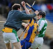 22 February 2009; Ciaran Ryan, Portumna, is tackled by James Connolly, left, and Paul Shefflin, Ballyhale Shamrocks. The tackle resulted in a penalty which was subsequently scored by Portumna's Joe Canning for his side's second goal. AIB All-Ireland Senior Club Hurling Championship Semi-Final, Ballyhale Shamrocks v Portumna, Semple Stadium, Thurles, Co. Tipperary. Picture credit: Brian Lawless / SPORTSFILE