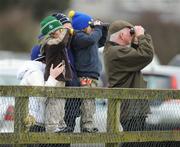 22 February 2009; Four-year-old Cian Burke and his brother Cormac, six, father Joe and sister Caoimhe watch the main race along with Des Gaffney, right. Naas Racecourse, Woodlands Park, Co. Kildare. Picture credit: Matt Browne / SPORTSFILE