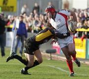 22 February 2009; David Pollock, Ulster Rugby, looks inside for support as Martyn Thomas, Newport Gwent Dragons, makes the tackle. Magners League, Newport Gwent Dragons v Ulster Rugby, Rodney Parade, South Wales. Picture credit: Steve Pope / SPORTSFILE