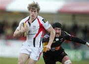 22 February 2009; Andrew Trimble, Ulster Rugby, gets away from Hoani Macdonald, Newport Gwent Dragons. Magners League, Newport Gwent Dragons v Ulster Rugby, Rodney Parade, South Wales. Picture credit: Steve Pope / SPORTSFILE