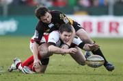 22 February 2009; Darren Cave, Ulster Rugby, and Phil Dollman, Newport Gwent Dragons, battle for the loose ball. Magners League, Newport Gwent Dragons v Ulster Rugby, Rodney Parade, South Wales. Picture credit: Steve Pope / SPORTSFILE