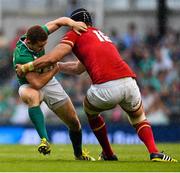 29 August 2015; Paddy Jackson, Ireland, is tackled by Luke Charteris, Wales. Rugby World Cup Warm-Up Match, Ireland v Wales, Aviva Stadium, Lansdowne Road, Dublin. Picture credit: Ramsey Cardy / SPORTSFILE